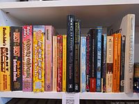 Front view of shelf showing all humour books described