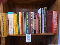 Front view of books on a shelf showing spines and titles