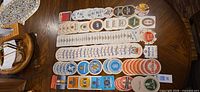 Top-down view of entire assortment of German beer coasters laid out in rows