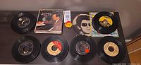 Overview of several representative 45s plus small album stack