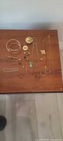 All jewelry pieces laid out on table