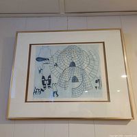 Framed engraving hanging on wall