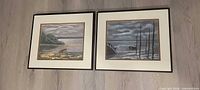 Both framed pastel artworks side by side
