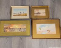 All four framed watercolours laid out