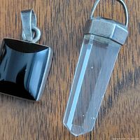 Front view of both pendants on wood surface