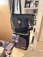 Both Thermos items stacked: quilted tote on top, soft cooler below