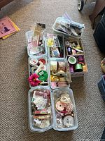 Six tubs filled with assorted ribbon spools, trims, beads and embellishments