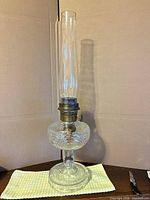 full view of glass oil lamp with chimney