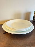 Stacked view of all seven plates showing size difference