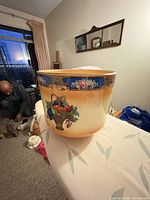 Front view showing overall shape, colour gradient and fruit basket motif