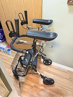 Side view of Evolution rollator showing forearm platforms, seat, basket and wheels