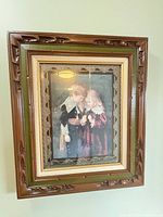 Full view of framed print hanging on wall