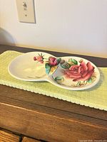 Full view of double divided dish showing rose artwork and sculpted center rose