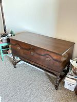 Full view of cedar blanket chest on stand