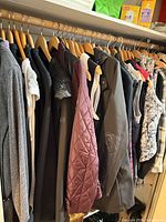 Closet rod with multiple coats, jackets and vests