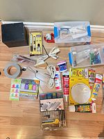 Overall view of lot showing majority of items laid out on floor