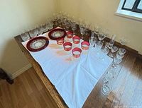 All glassware laid out on table showing quantity and variety