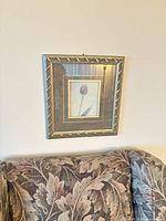 Full view of framed tulip print above sofa