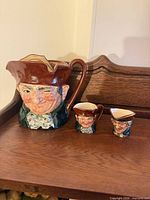 Set overview on wooden surface showing all three jugs