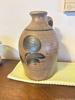 Front view of jug showing cobalt floral motif and overall form