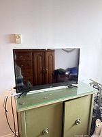 Front view of Samsung 32-inch TV on stand