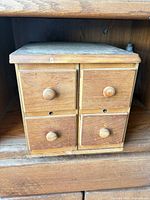 Front view of 4-drawer wooden organizer