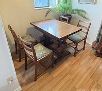 full dining set showing table and four chairs