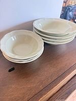 Stacked view showing four small bowls and three larger bowls