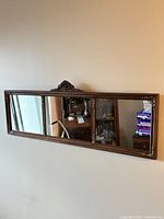 Full view of three-panel mirror on wall