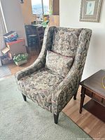 Full view of wingback chair and pillow