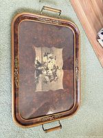 Top view of tray showing glass surface, burl pattern, floral bouquet