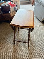 Three-quarter view of table with leaf down