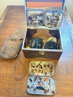 Overall view with tackle box open showing reels, fly boxes and suede pouch