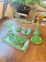All ten uranium glass pieces displayed on table