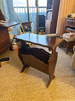 Full view of magazine rack side table showing overall design