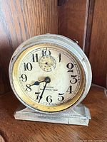 Front view of Westclox Baby Ben De Luxe clock showing dial and overall wear