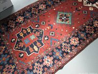 Top view of hand-knotted Turkman wool runner showing pattern and condition
