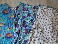 Three scrub tops laid out showing prints and style