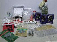 Full lot layout showing ornament sets, craft supplies and storage items