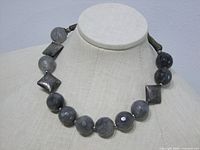 Necklace on mannequin showing overall design and bead arrangement