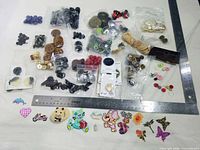 overview of all button packets, loose buttons, appliqués and ruler for scale