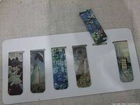 Six Monet-themed magnetic bookmarks on display card