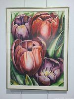 Frontal view of framed watercolor painting in gold-tone frame