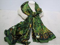 Full view of green satin scarf draped to show size and sheen