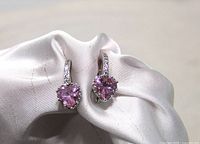 Front view of both earrings showing pink heart crystals and CZ halo