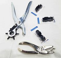 Two punch tools and three rivet packs laid out