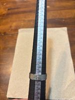 Dragon motif ring on mandrel showing size 11