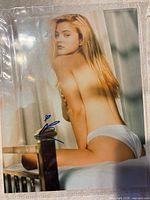 Front view of signed 8x10 photograph showing image and blue ink autograph