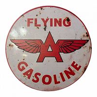 Full view of Flying A Gasoline sign showing graphics and rust spots