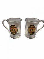 Front view of both frosted Butterbeer mugs showing graphics and shape